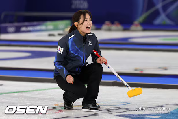 South Korea women's curling team delivering a stone during South Korea vs China Winter Olympics 2026 preliminary match