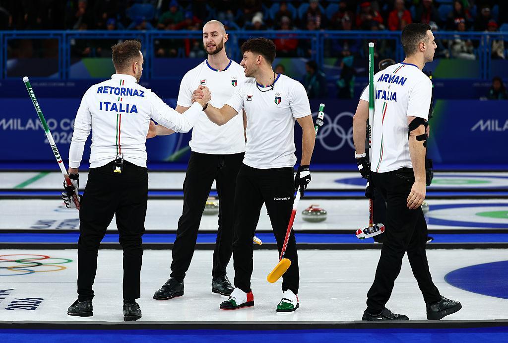 Italy men's curling team sweeping stone in preliminary round match February 2026
