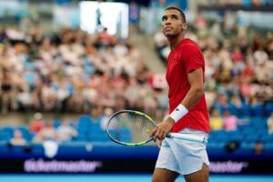 Medvedev hitting backhand during 2026 semifinal tennis match on Centre Court